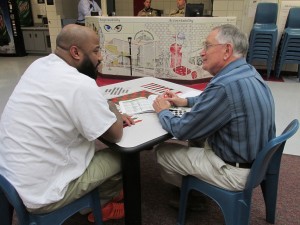 Bob Barry and an inmate at the Dakota County Jail discuss jobs