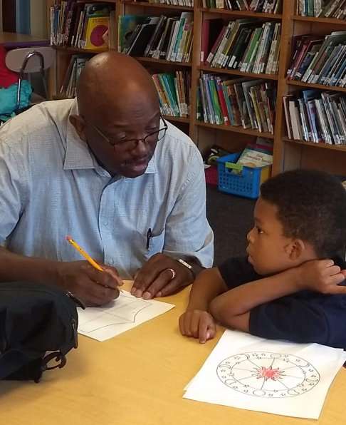 IVC Volunteer working on child-friendly activities
