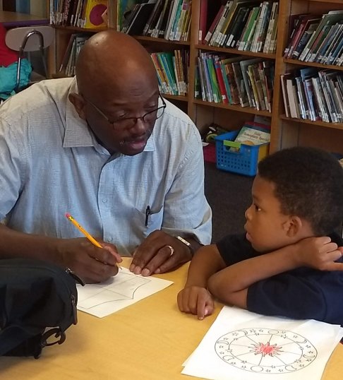 IVC Volunteer working on child-friendly activities